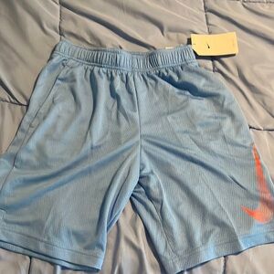 Nike youth large dry fit light blue shorts with pockets